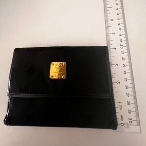 MCM Black Patent Accessory with Gold Logo Plate